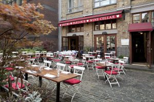 French bistro tables outside of Bleeding Heart bistro
